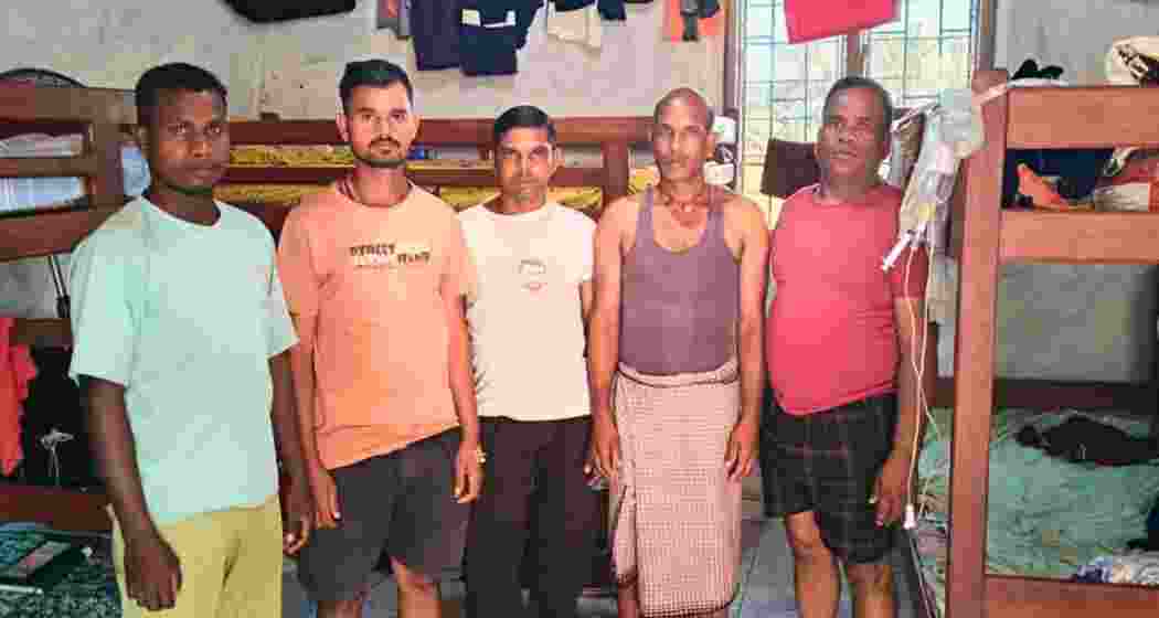 Five Jharkhand workers stranded in Cameroon pose for a photo, appealing for urgent government intervention to secure their safe return home.