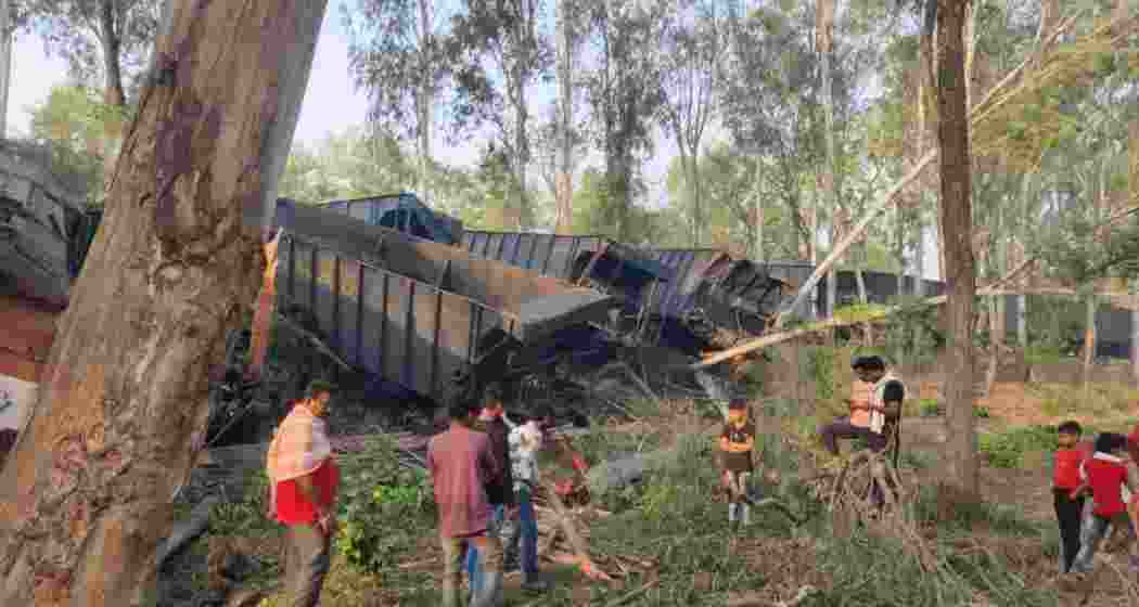 Locals inspect the debris after a collision between two NTPC-operated goods trains in Jharkhand’s Sahebganj district, which resulted in the deaths of two drivers and left four others injured.