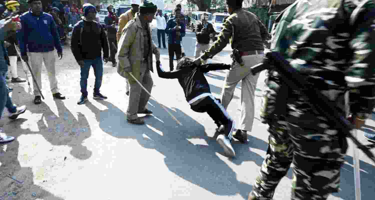 Police use force to disperse a protesting mob of students against alleged irregularities in JSSC-CGL examination in Ranchi on Monday. 