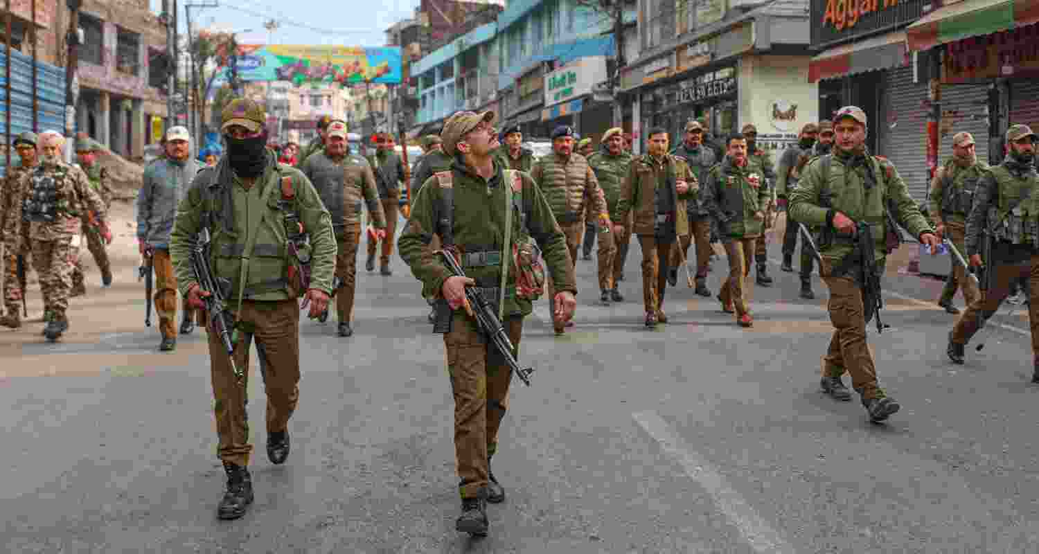 Security personnel patrol during a shutdown, being observed to protest the proposed ropeway project connecting Tarakote Marg to Sanji Chhat, which leads to the Mata Vaishno Devi shrine, in Reasi district of Jammu and Kashmir, Wednesday. 