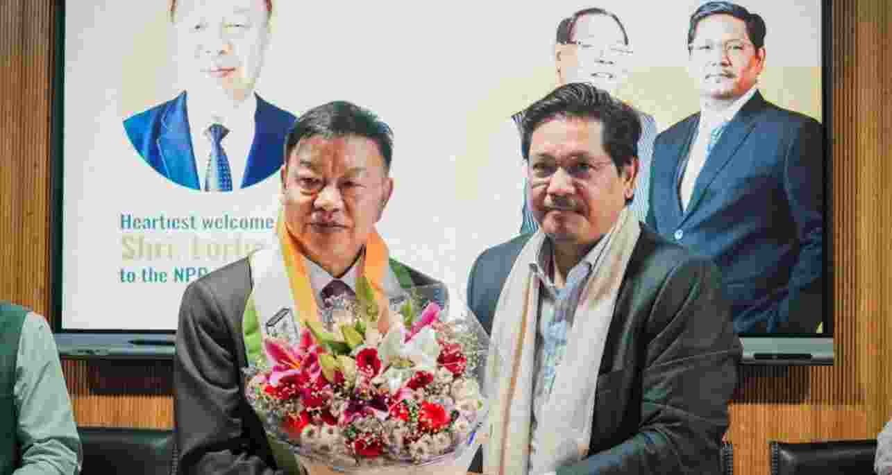 Dr Lorho S Pfoze, former Lok Sabha member from Outer Manipur, into the NPP on Tuesday.