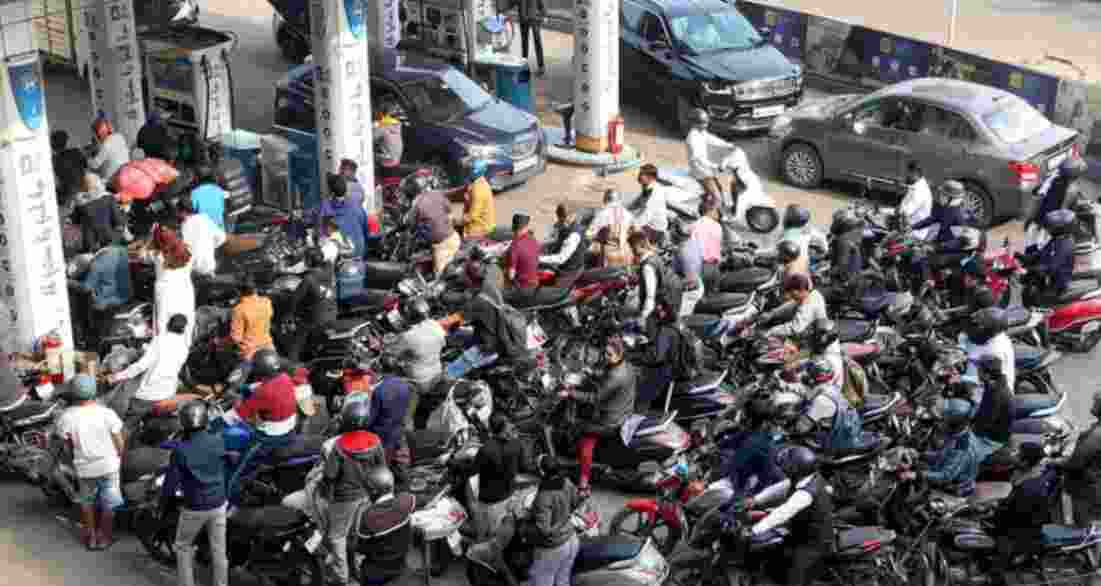 People wait in queue to get fuel - file image.