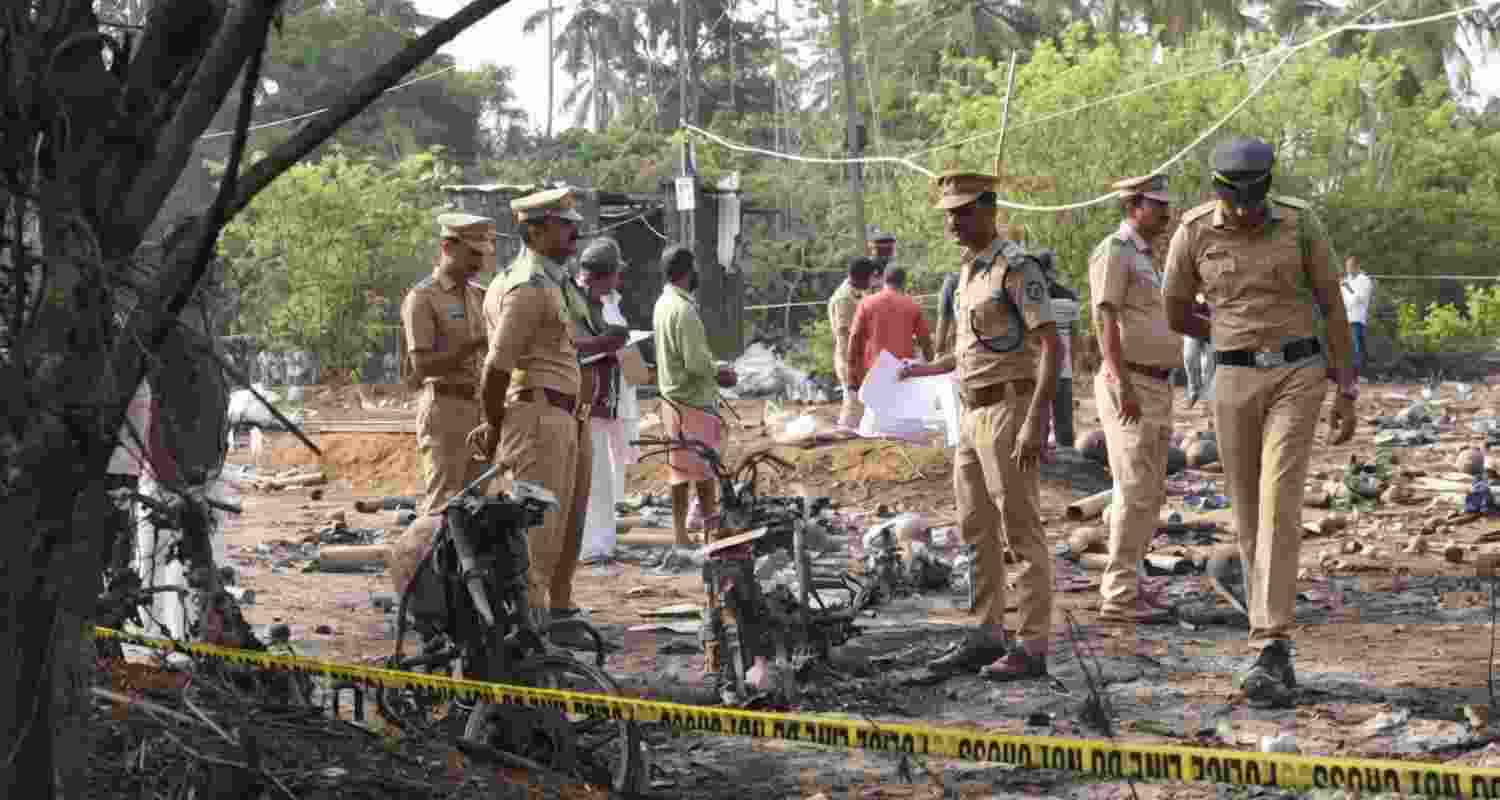 Police officials conduct a search operation after a blast at a fireworks manufacturing unit on Tuesday night, at Mundathicode in central Kerala's Thrissur district, Wednesday, April 22, 2026. At least 13 people were killed and several others were injured in the incident.