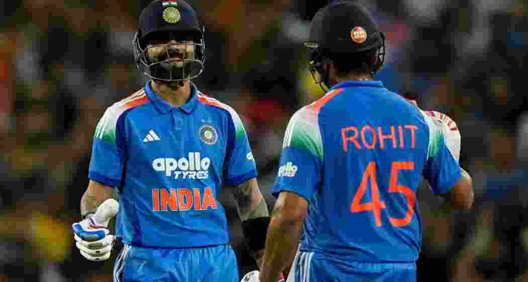 Rohit Sharma and Virat Kohli celebrate India’s emphatic 9-wicket win over Australia at Sydney Cricket Ground.