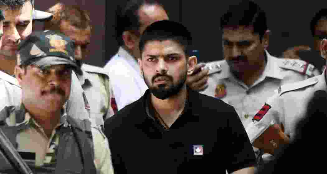 Policemen escort Lawrence Bishnoi at a court in New Delhi, India, in 2023. (ANI)