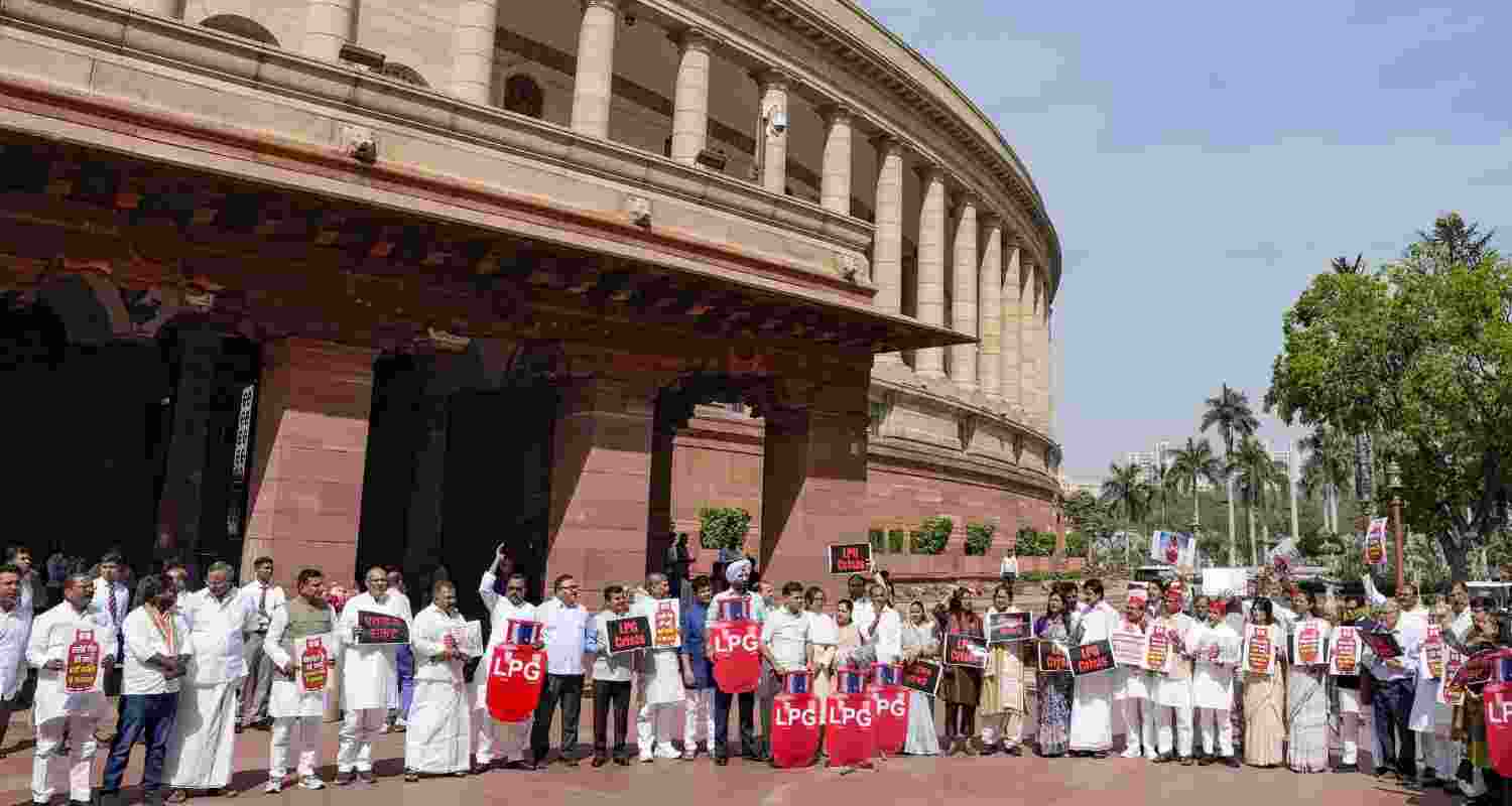  Congress MPs KC Venugopal, Hibi Eden, Manickam Tagore, Samajwadi Party MPs Ram Gopal Yadav, Dimple Yadav, Dharmendra Yadav, TMC MPs Dola Sen, Sagarika Ghose, and others stage a protest over "LPG crisis" during the second part of the Budget session of Parliament, in New Delhi, Friday, March 13, 2026.