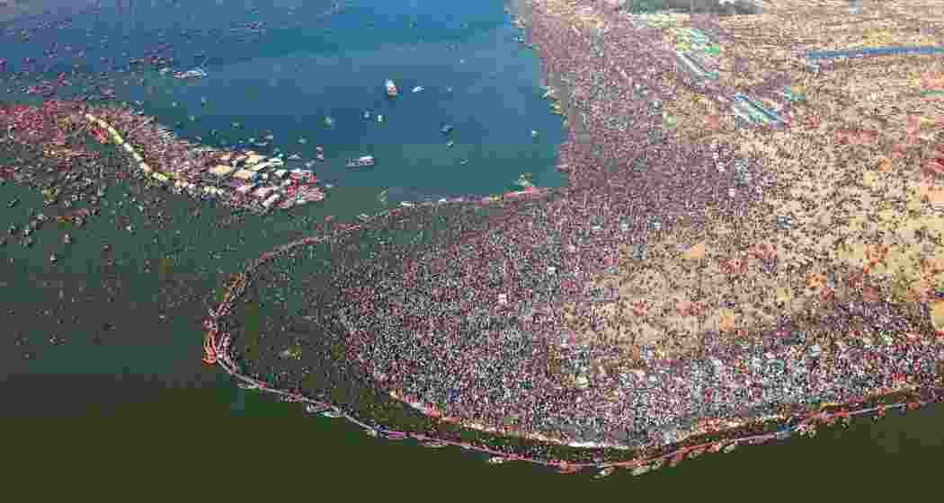 
Devotees throng the illuminated Sangam area in Prayagraj on Mahashivratri, marking the culmination of the Maha Kumbh Mela with the final Amrit Snan at the sacred confluence of the rivers.