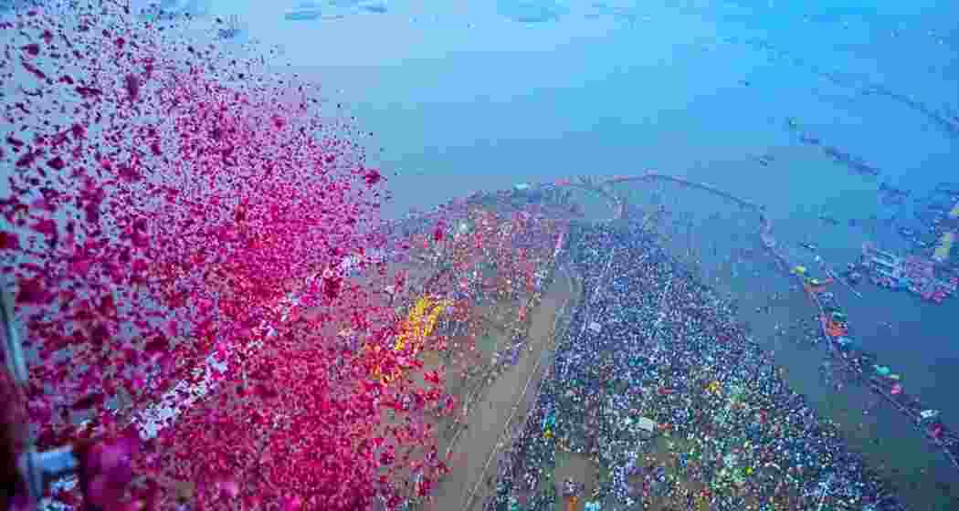 Flower petals being showered on saints and seers during the ‘Amrit Snan’ at Triveni Sangam on Basant Panchami in Prayagraj. 