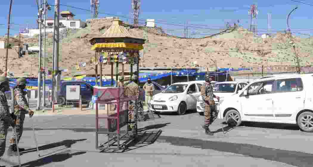 Police personnel stand guard in a sensitive area of Tura in Meghalaya’s West Garo Hills district after violence linked to GHADC election nominations prompted curfew and deployment of security forces.