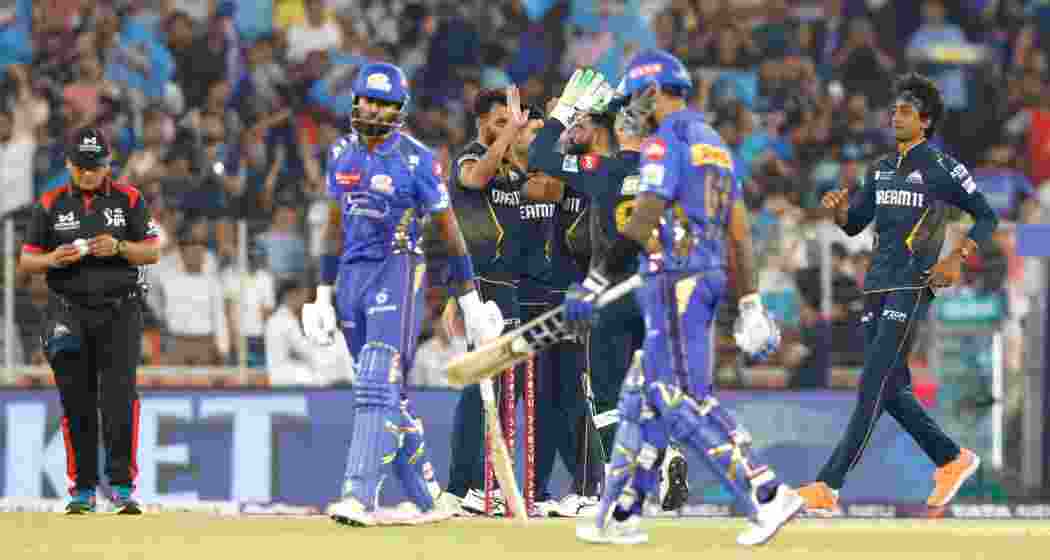 Prasidh Krishna celebrates after dismissing Suryakumar Yadav, sealing Gujarat Titans’ victory over Mumbai Indians in their IPL clash in Ahmedabad. His incisive spell derailed Mumbai’s chase, securing GT’s first win of the season.