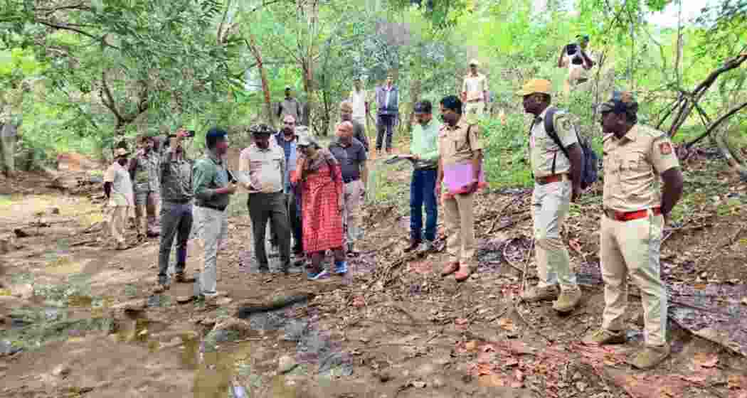 Forest officials at Male Mahadeshwara Hills following the recovery of a tiger carcass. 