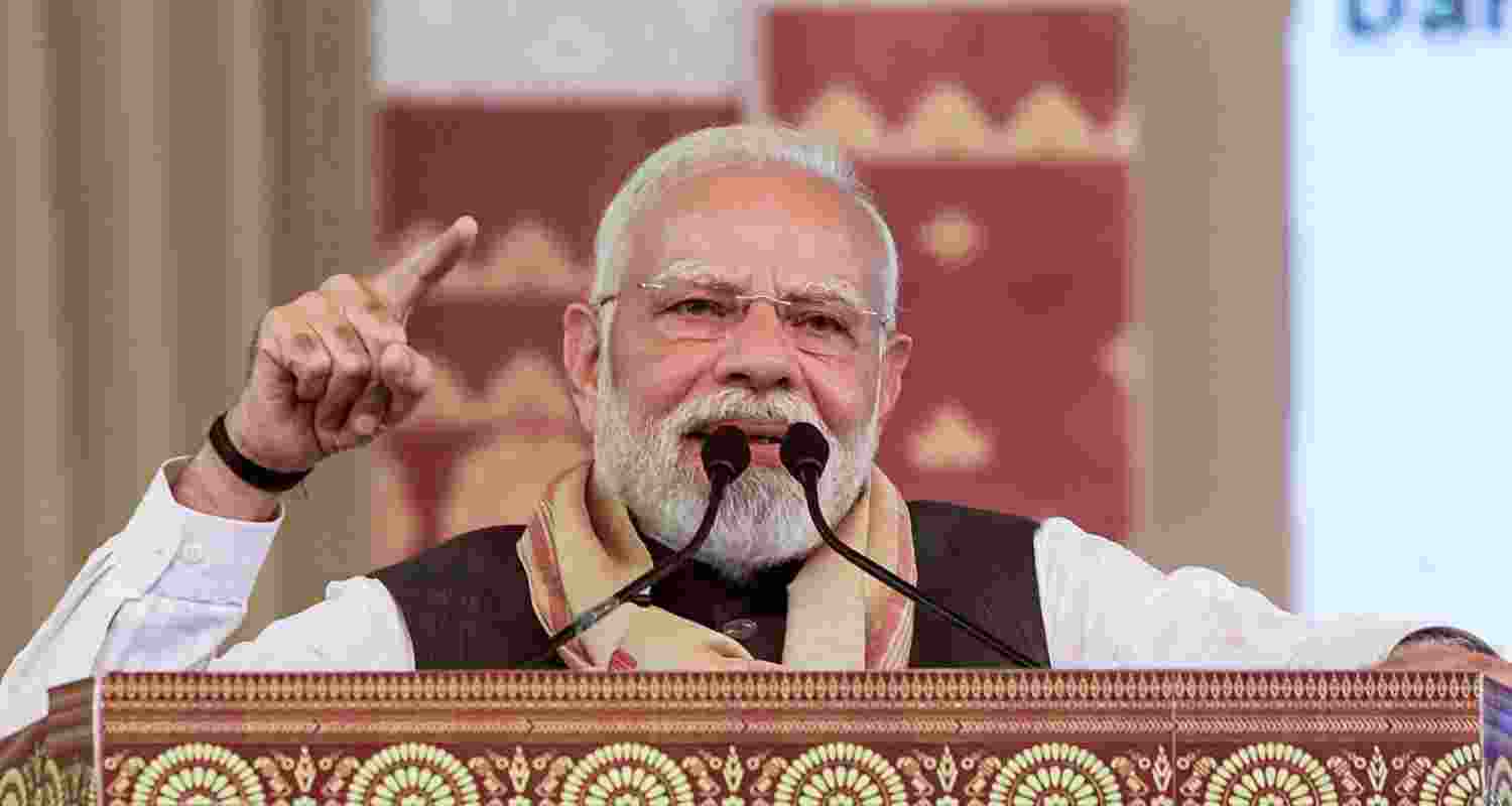 Prime Minister Narendra Modi with Assam Chief Minister Himanta Biswa Sarma, right, during laying of foundation stone and inauguration of development works, in Darrang, Assam.