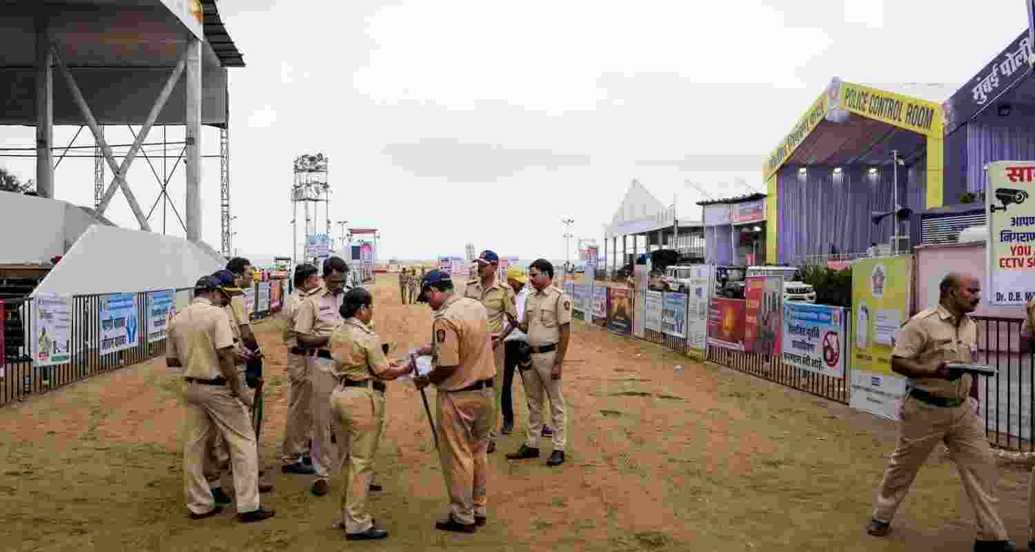 Mumbai Police personnel keep vigil as part of crowd control measures for the immersion of Lord Ganesh idols as the Ganesh Chaturthi festival concludes, at Girgaon Chowpatty, in Mumbai. 