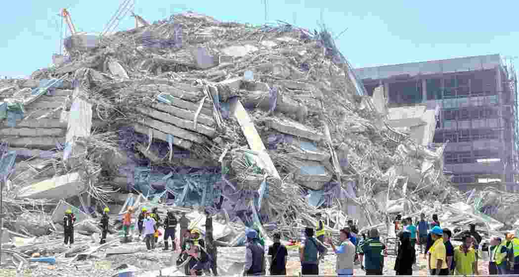 Rescuers work at the site of a collapsed building in Bangkok, Thailand on March 28, 2025