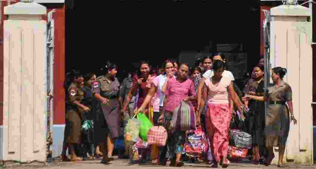 Prisoners coming out of Insein Prison in Yangon after Myanmar's military government granted amnesty to nearly 4,900 detainees to mark the traditional New Year on April 17, 2025.