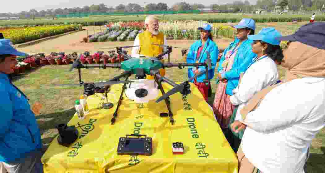 PM witnessing agricultural drone demonstrations by Namo Drone Didis during Sashakt Nari- Viksit Bharat programme at Indian Agricultural Research Institute, Pusa, in New Delhi on Monday.