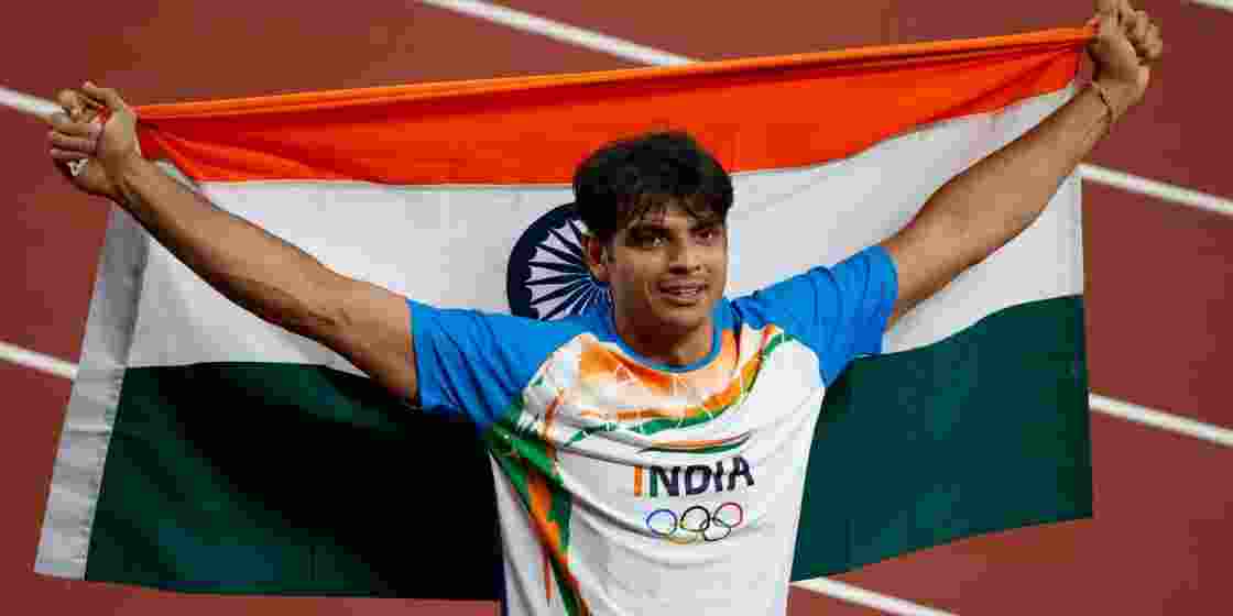 Neeraj Chopra celebrates after winning gold in the men's javelin throw at the Tokyo 2020 Olympics.