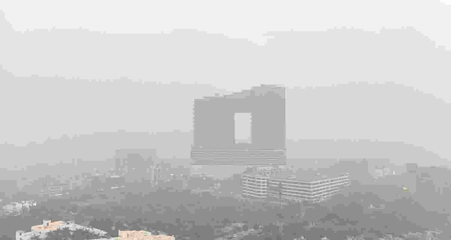 A layer of smog engulfs the city on a winter day, in Noida, Thursday.
