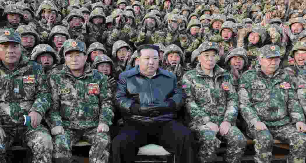 North Korean leader Kim Jong Un poses with troops.