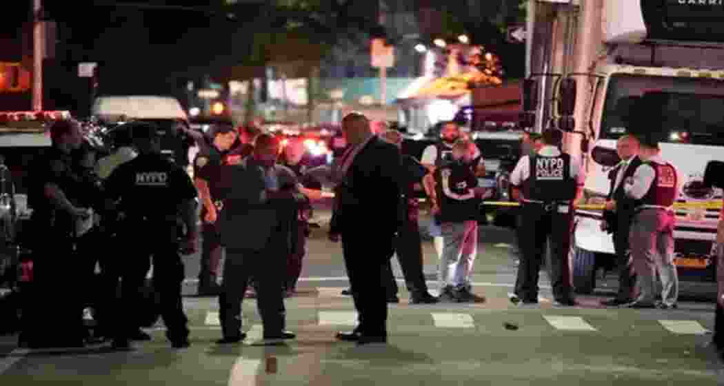 Police and emergency personnel respond to the scene of a mass shooting outside Amazura nightclub in Queens, New York.