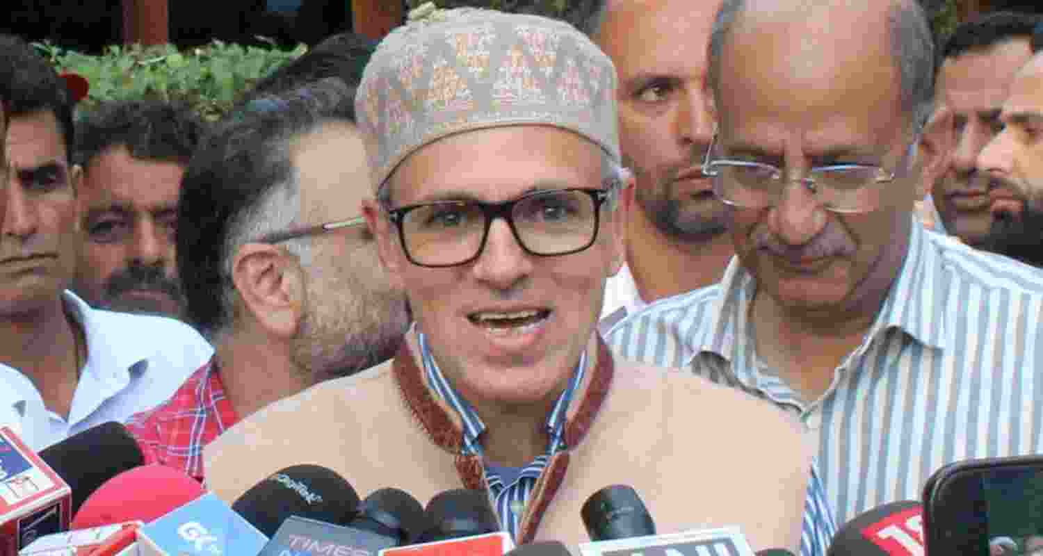 Omar Abdullah addresses reporters outside party office.