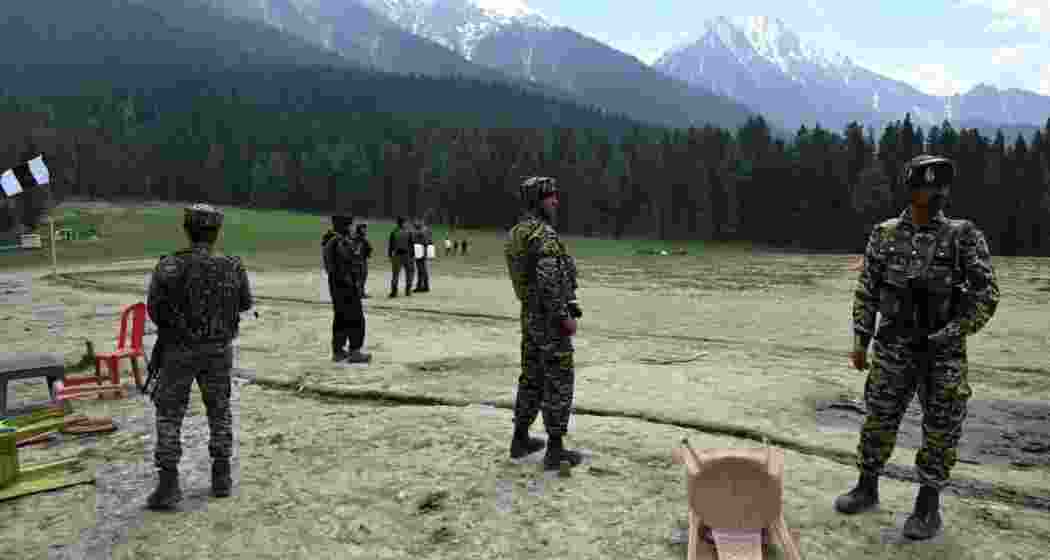 Military personnel keep a vigilant watch and assess the aftermath following the Pahalgam attack.