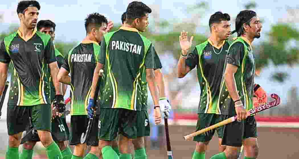 Pakistan Junior Hockey team members in action during a match. 