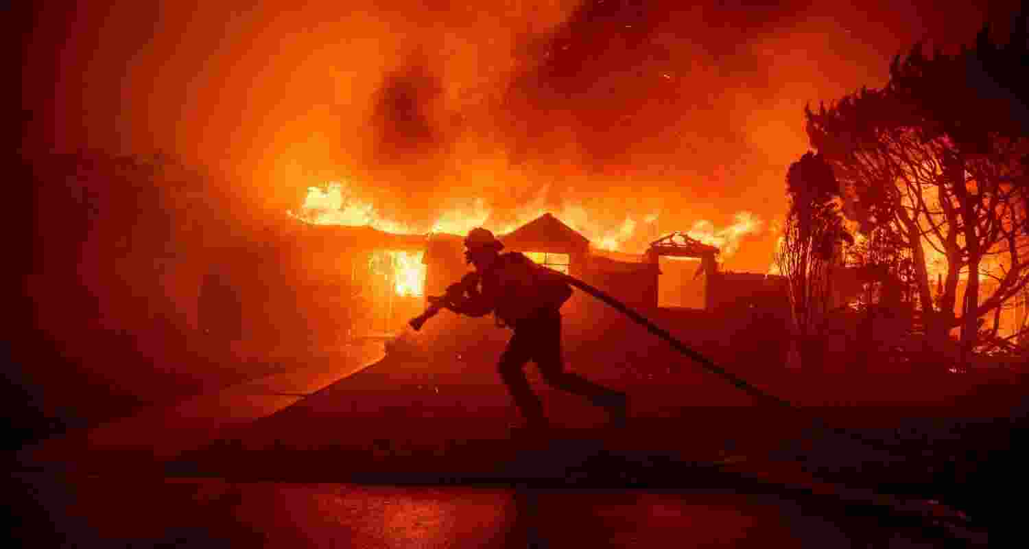 A firefighter battles the Palisades Fire as it burns a structure in the Pacific Palisades neighbourhood of Los Angeles. A firefighter battles the Palisades Fire as it burns a structure in the Pacific Palisades neighbourhood of Los Angeles.