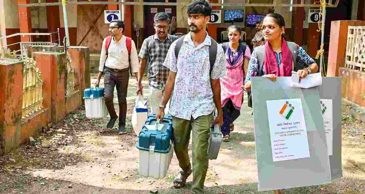Polling officials with EVMs and other election material leave for their respective polling stations on the eve of the Palakkad Assembly constituency by-elections, in Palakkad, Kerala, Tuesday, 