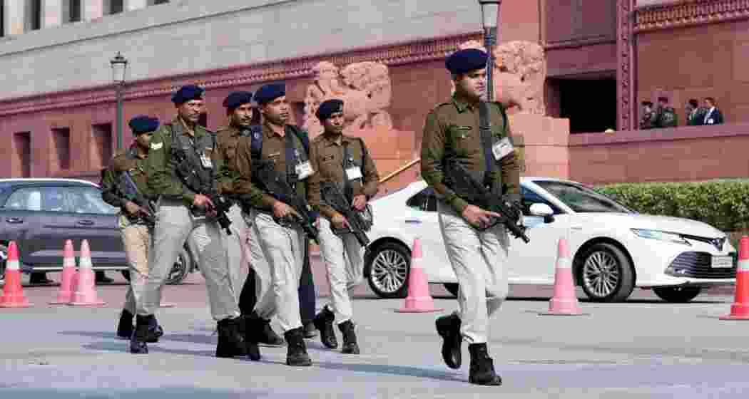 A file photo of armed security personnel patrol the Parliament House premises day after a security breach on the anniversary of the 2001 Parliament terror attack, in New Delhi.