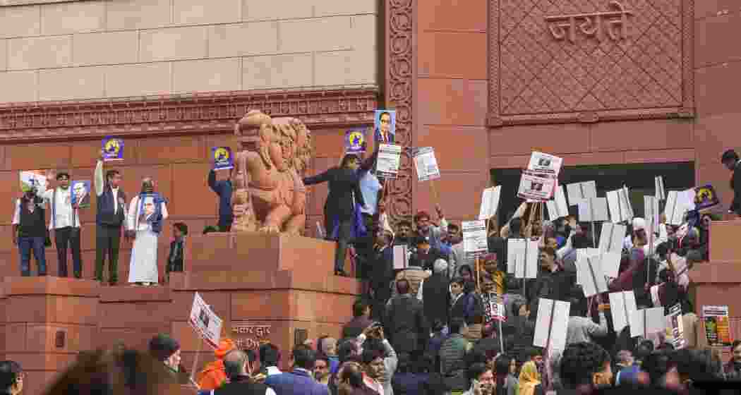 NDA and INDIA bloc members during a protest over Dr BR Ambedkar at Parliament premises, in New Delhi on Thursday, Dec. 19, 2024. 