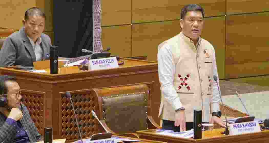 Officials and workers stand beside the first boundary pillar erected along the Arunachal Pradesh–Assam interstate border during the demarcation exercise, marking the beginning of the phased boundary settlement process. (Image: Special arrangement)
