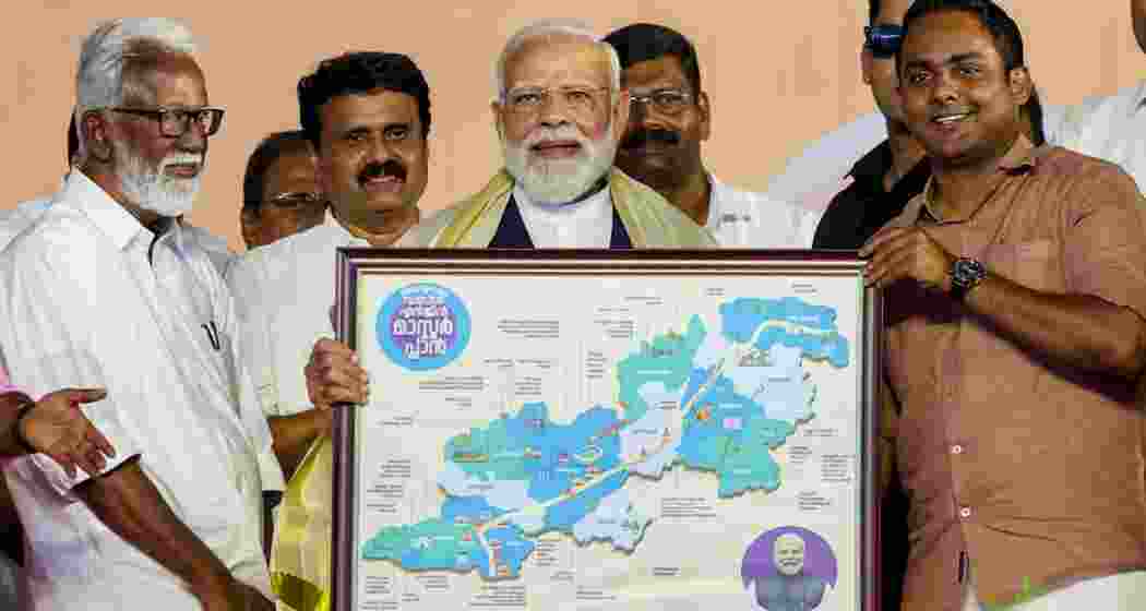 Prime Minister Narendra Modi being felicitated during a public meeting ahead of the Kerala Assembly elections, in Thiruvalla, Kerala.
