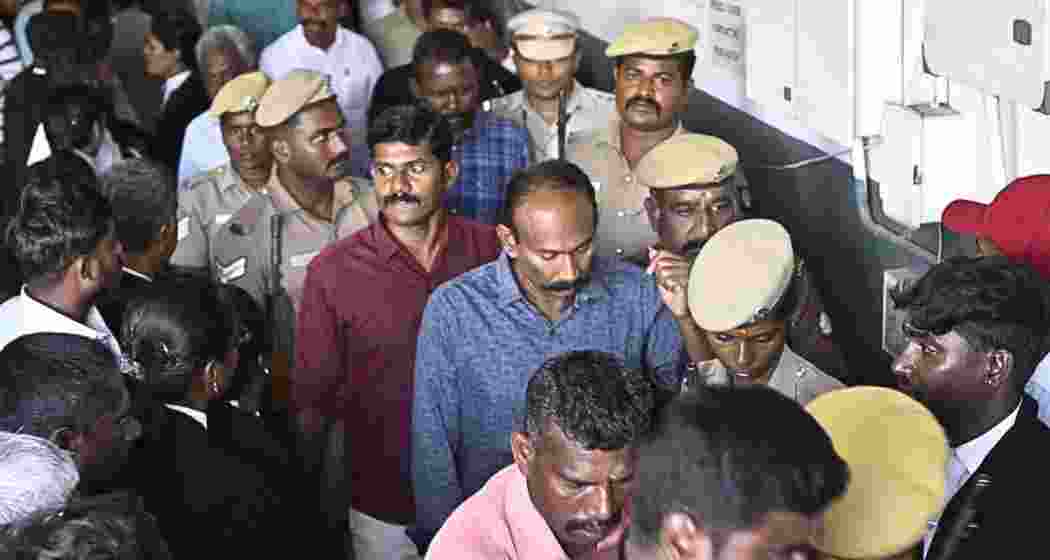Convicted police personnel are escorted by security officials before being produced in a court in Madurai following the verdict in the Sathankulam custodial deaths case. Convicted police personnel are escorted by security officials before being produced in a court in Madurai following the verdict in the Sathankulam custodial deaths case.