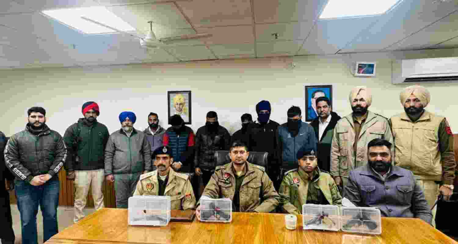 Punjab police alongside the arrested individuals