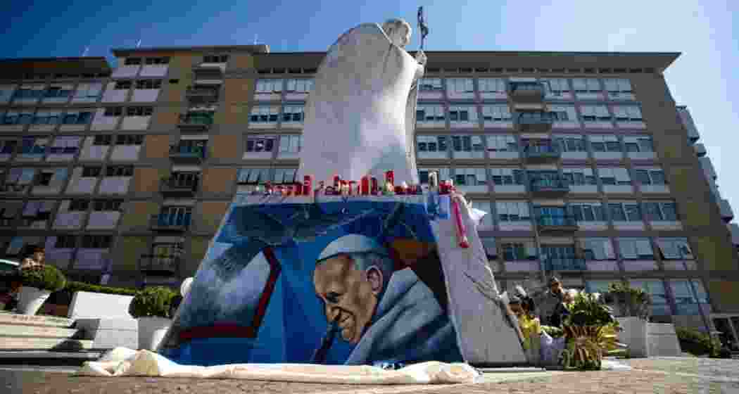 People pray for the Pope's health outside the Gemelli hospital.