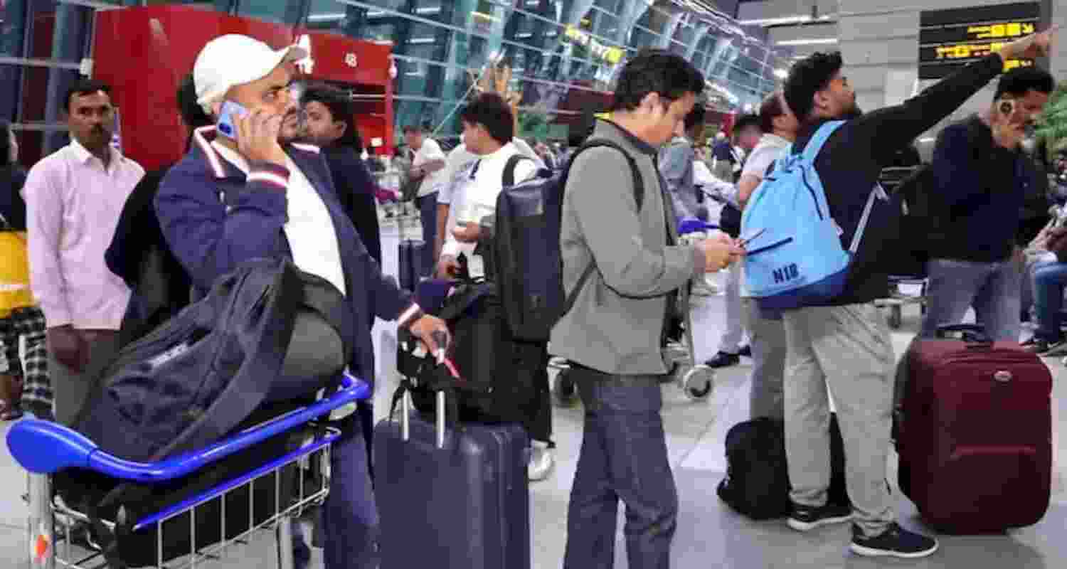 Passengers stranded at the Indira Gandhi International Airport in New Delhi on Tuesday.