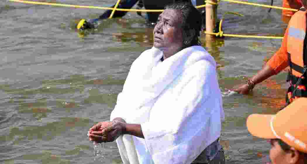 President Droupadi Murmu prays after taking a holy dip at the Sangam during Maha Kumbh Mela in Prayagraj on Monday. 
