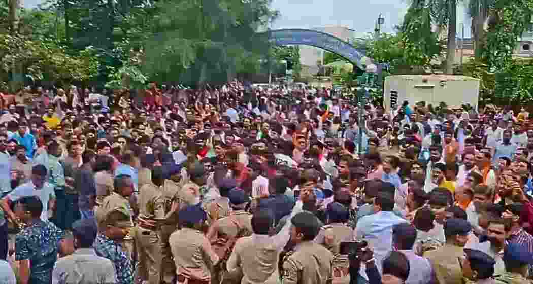 Parents, students and NSUI activists protest outside Seventh Day Adventist School in Ahmedabad after Nayan Santani’s killing, as police detain several and over 500 are booked for vandalism across the city.