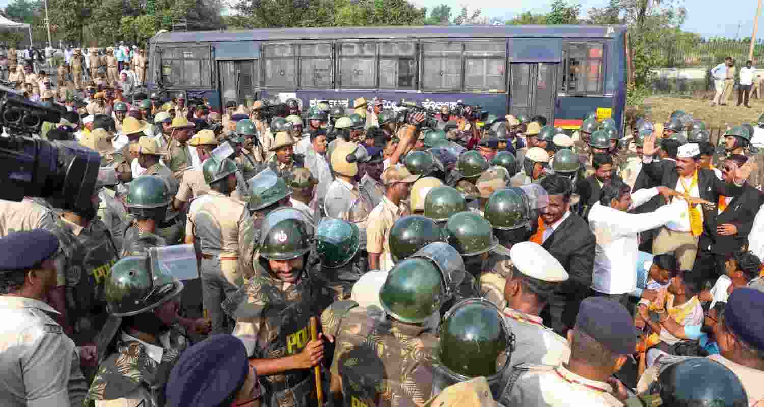 Belagavi: Police personnel stop protestors who were attempting to barge into Suvarna Vikasa Soudha during their protest demanding quota for the Panchamasali Lingayat community, in Belagavi, Tuesday.