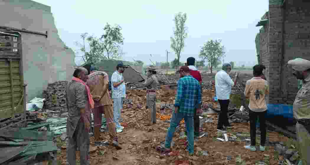 Officials inspect the debris at the firecracker unit in Muktsar’s Fatuhiwala village on Friday, hours after a powerful blast killed five migrant workers and injured 29 others.