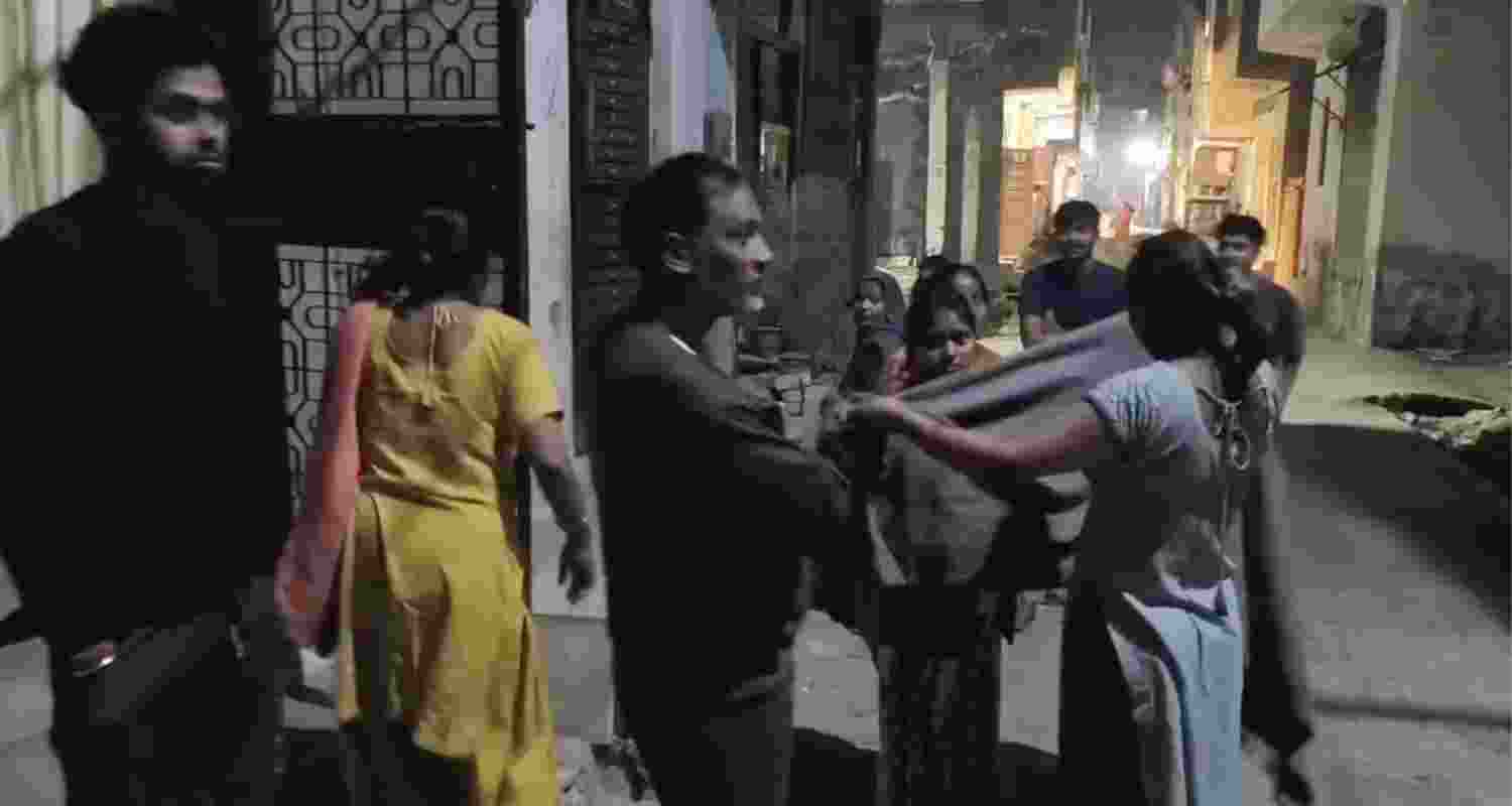People outside their homes after an earthquake hit the Delhi-National Capital Region on Monday.