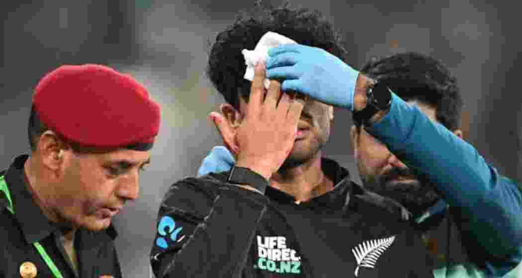 Rachin Ravindra being taken off the field after suffering a bleeding head injury during New Zealand's ODI match against Pakistan at Gaddafi Stadium, Lahore on Saturday.