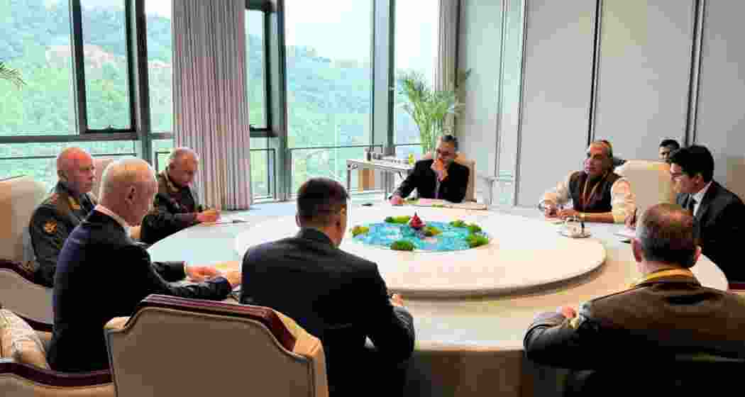 Defence Minister Rajnath Singh with Defence officials in Qingdao, China, on Thursday, where he declined to sign a joint communique, citing a weak stance on state-sponsored terrorism.