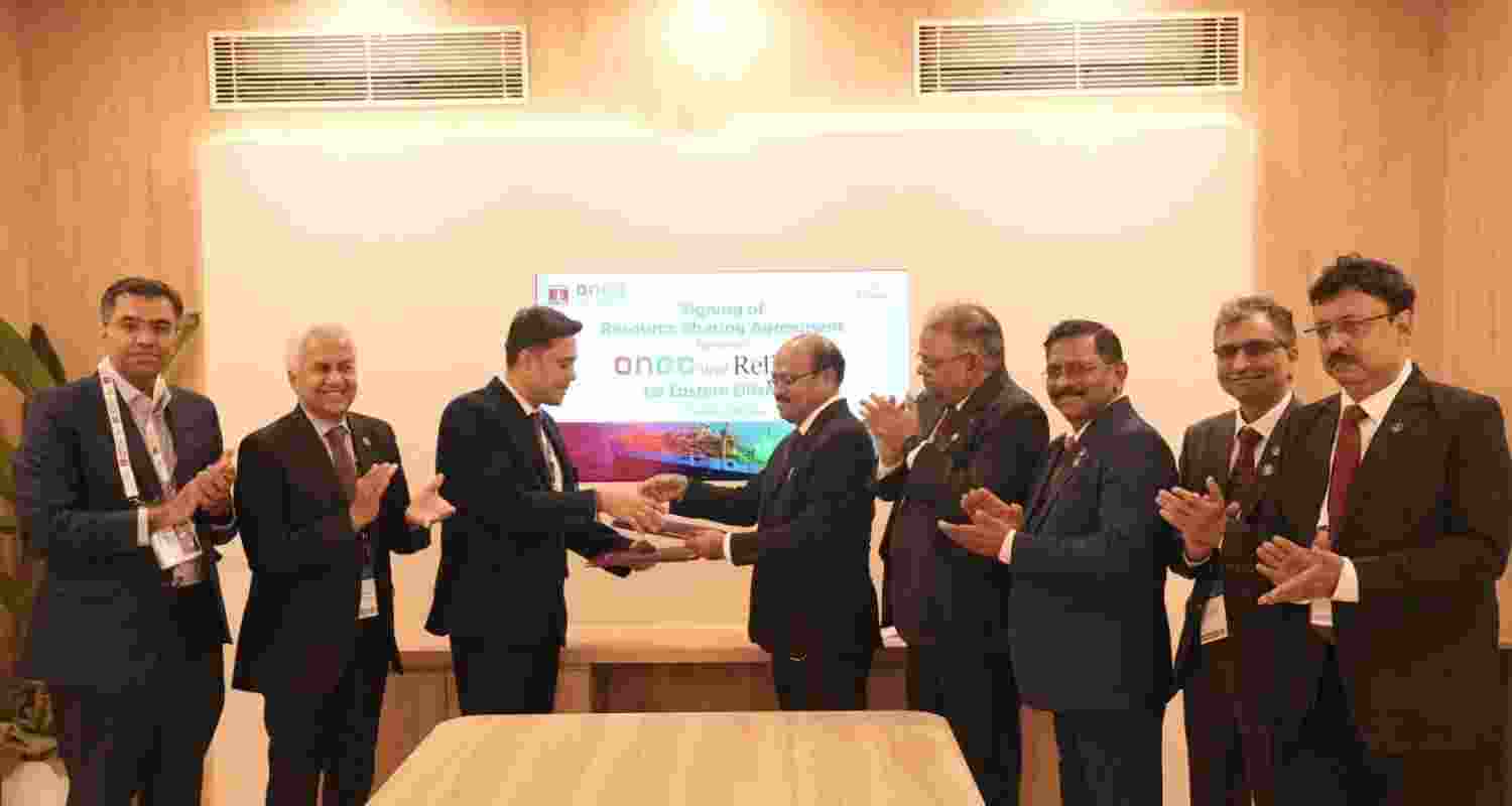 ONGC and Reliance officials after signing the agreement on Wednesday.