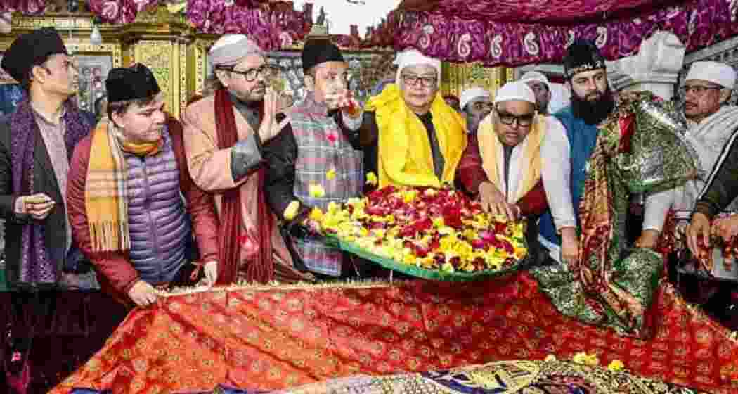 Union Minister for Minority Affairs Kiren Rijiju offers a ceremonial 'chadar' on behalf of Prime Minister Narendra Modi at the Hazrat Nizamuddin Dargah.