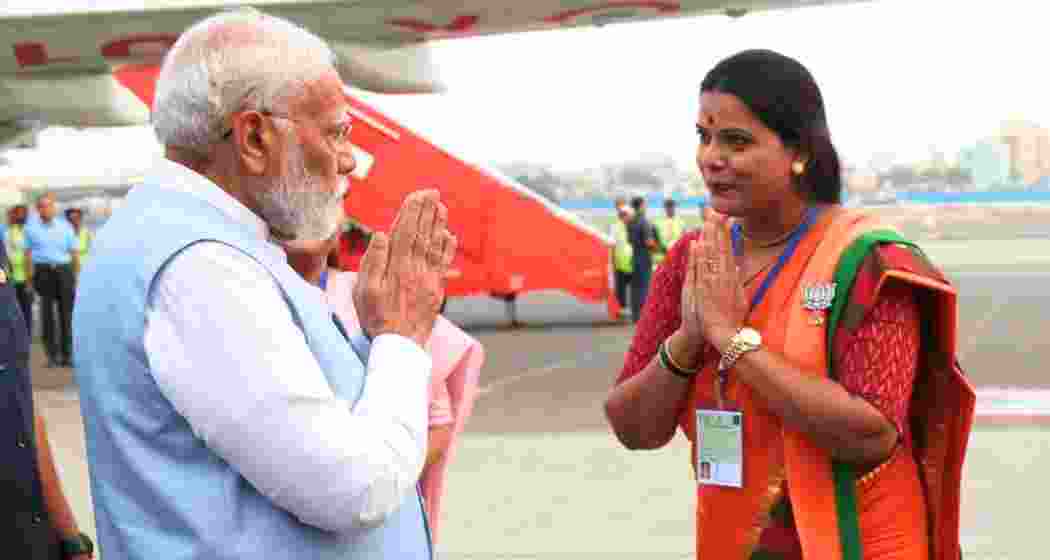 BJP’s Ritu Tawde greets Prime Minister Narendra Modi. (image: PTI)