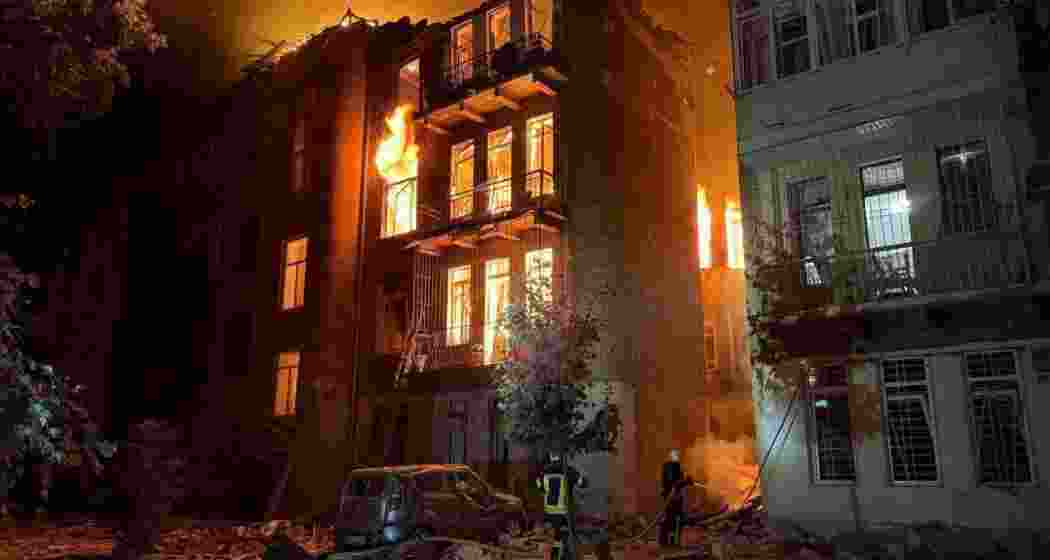 Firefighters in Odesa evacuate residents from a 23-storey building hit during Russia’s midnight drone assault. At least 13 people were injured in the multiple-site strikes, officials said.