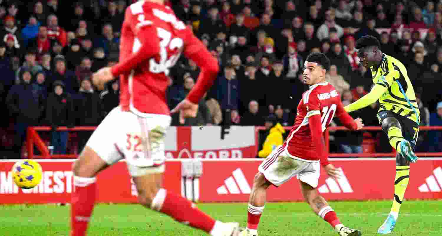 Arsenal football player scores a goal in the Premier League football that has resumed in London against Nottingham forest, taking them to No. 2 on the charts