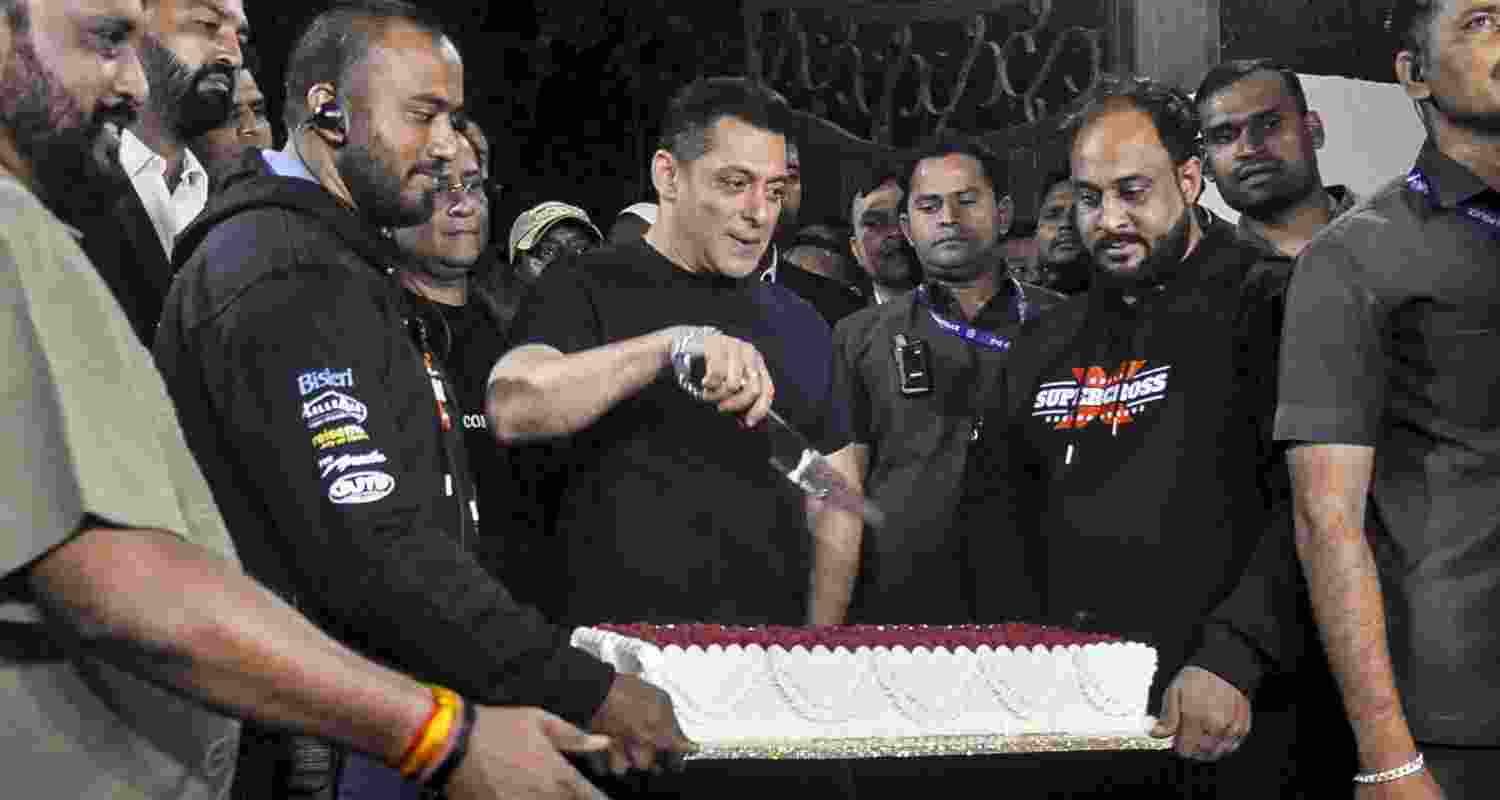 Bollywood actor Salman Khan cuts the cake during his 60th birthday celebration in Panvel, near Mumbai, Friday, Dec. 26, 2025.  